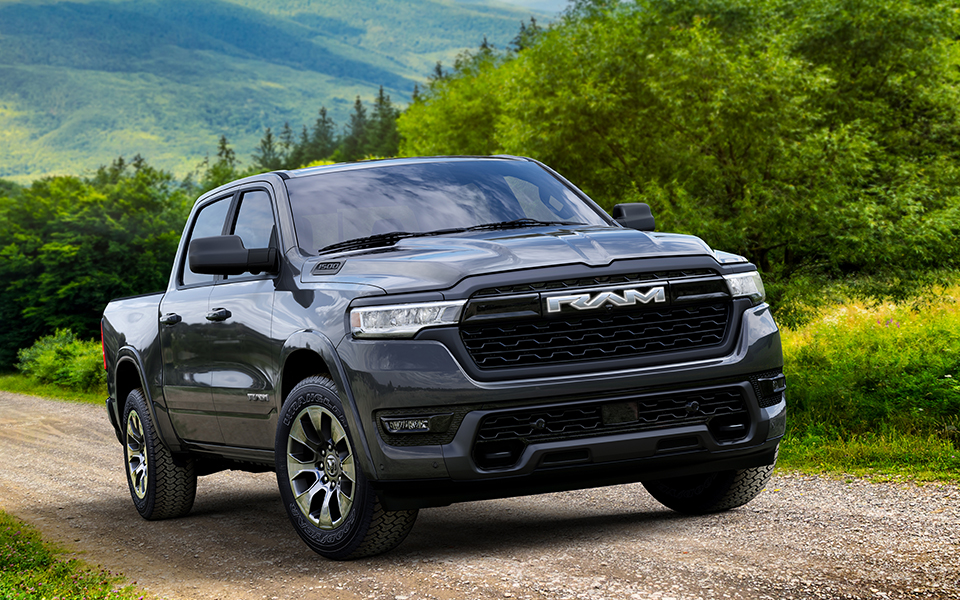 A black Ram 1500 truck driving off-road