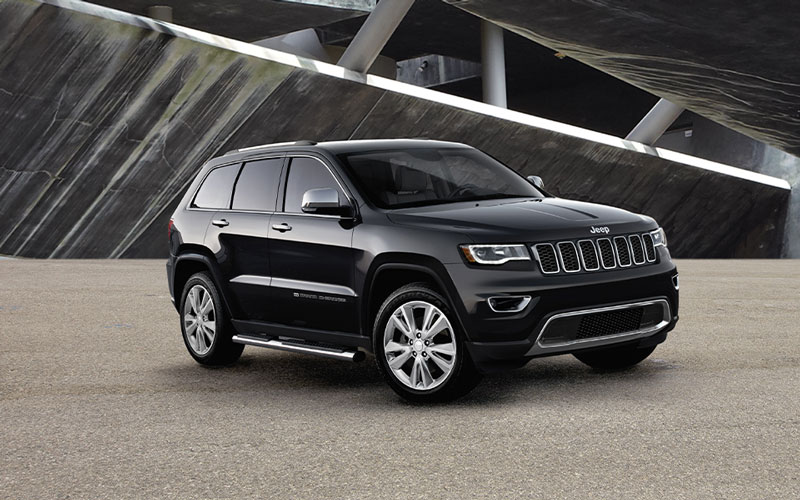 A Jeep Grand Cherokee parked inside a building at night