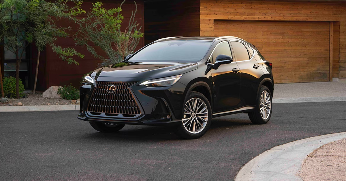 Black 2025 Lexus NX 350 parked in front of a home.