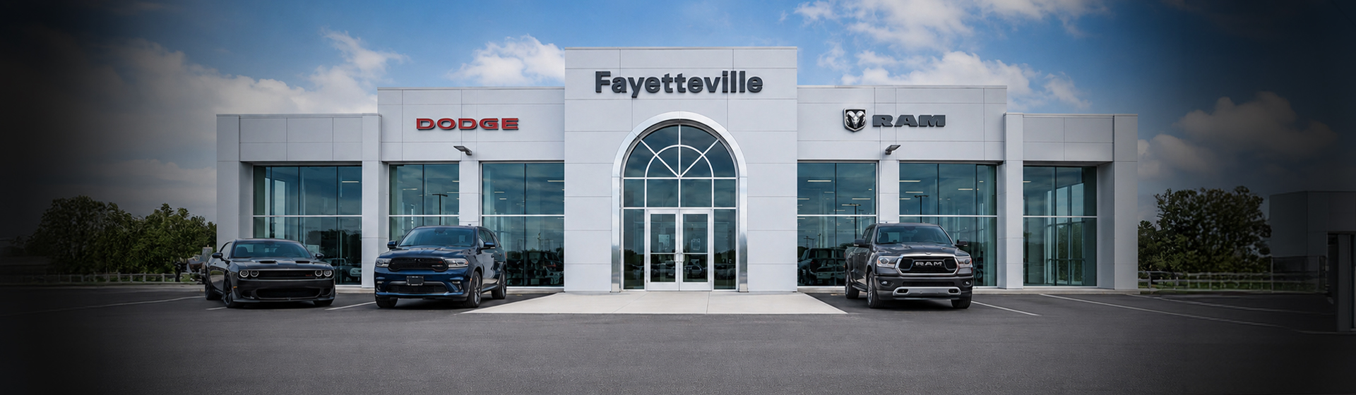 The front of the Fayetteville Dodge Ram dealership storefront.