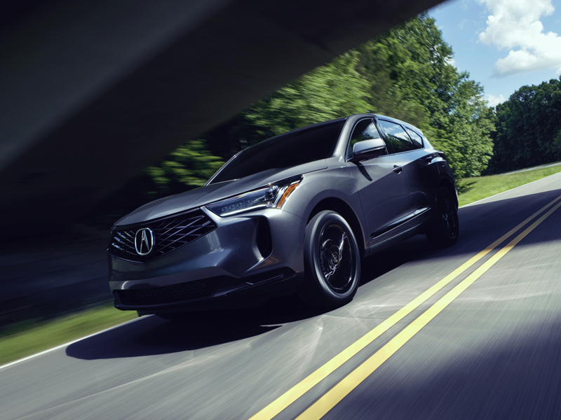 An Acura RDX driving down a highway.