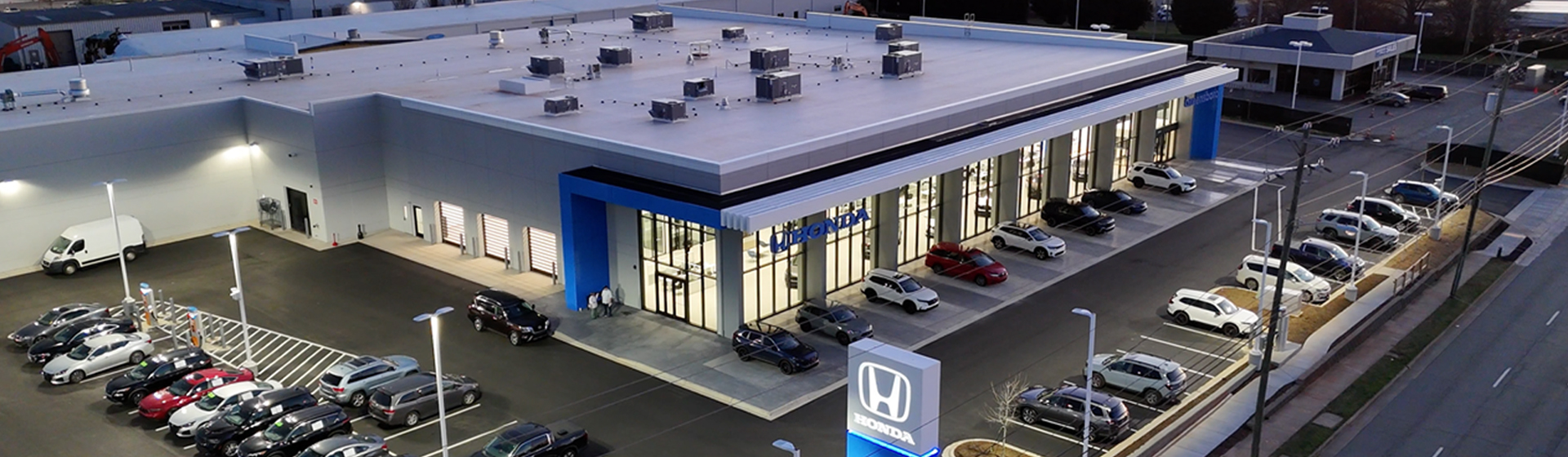 An aerial view of the Greensboro Honda dealership storefront