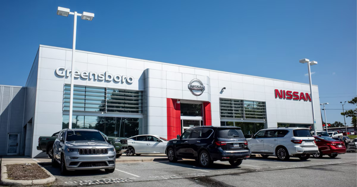 Greensboro Nissan dealership storefront and vehicle lot