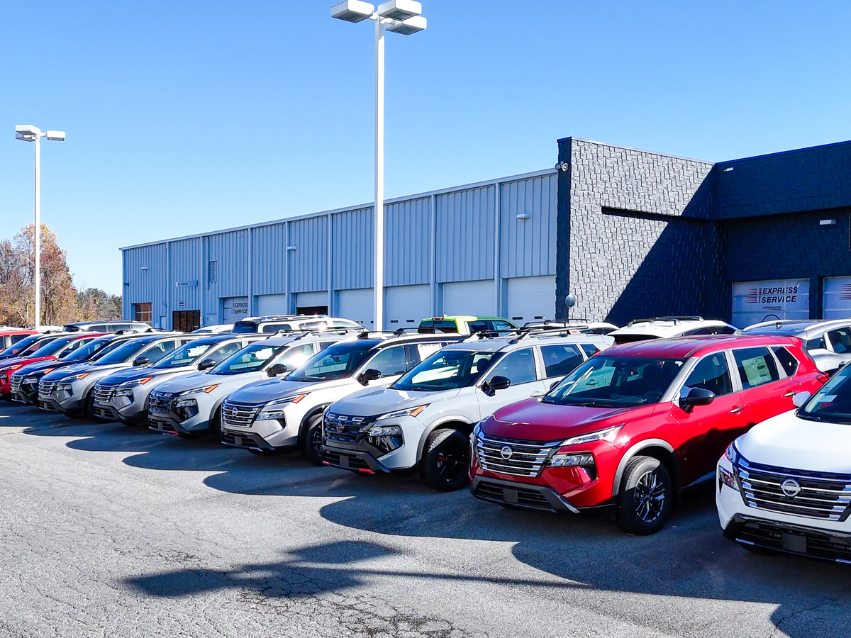 The Greensboro Nissan dealership vehicle lot with a variety of Nissan models.