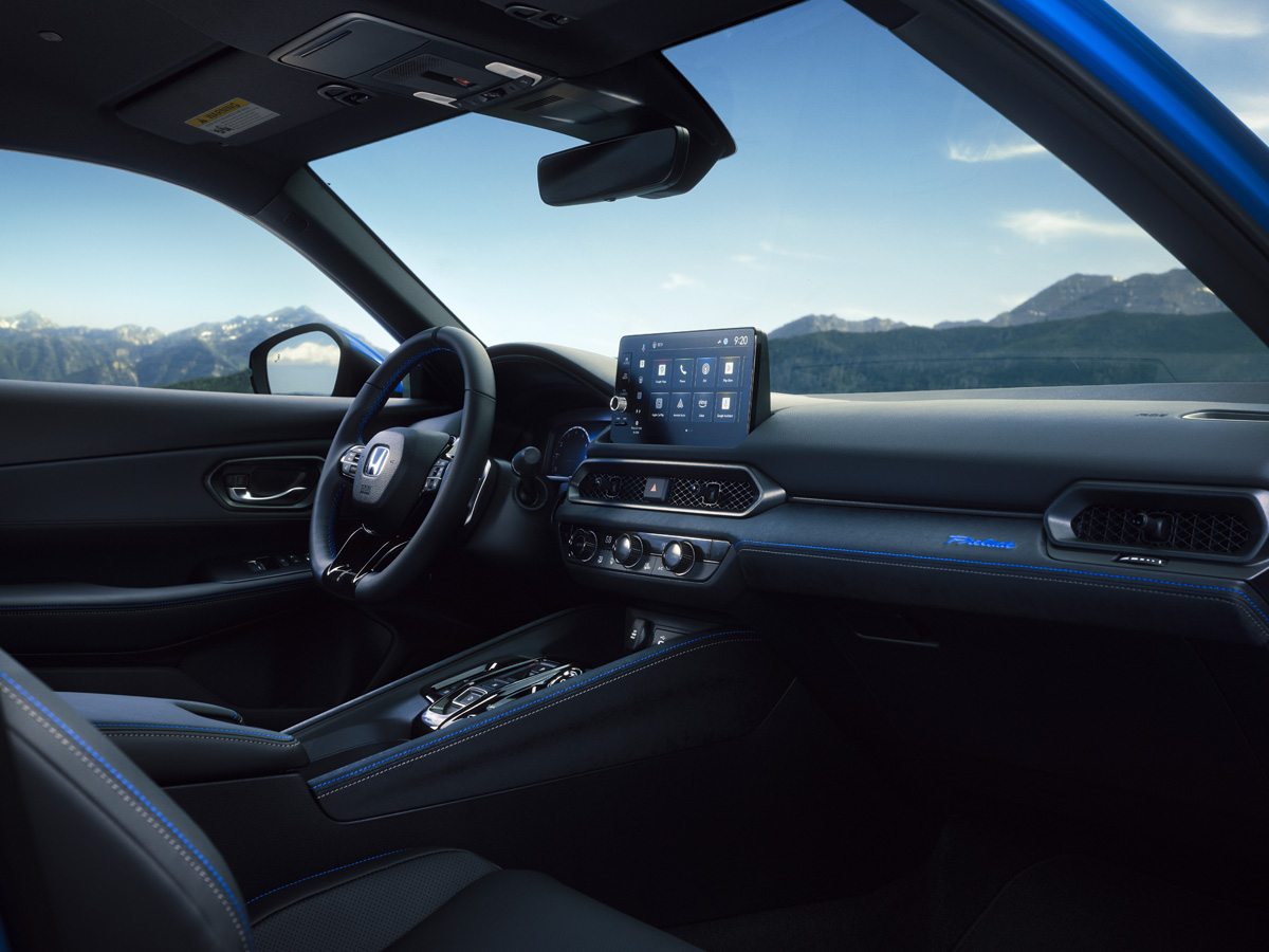 An interior view of the Honda Prelude showing off the dashboard and display.