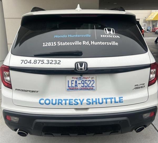 The back of a courtesy shuttle vehicle at the service center of Honda of Huntersville