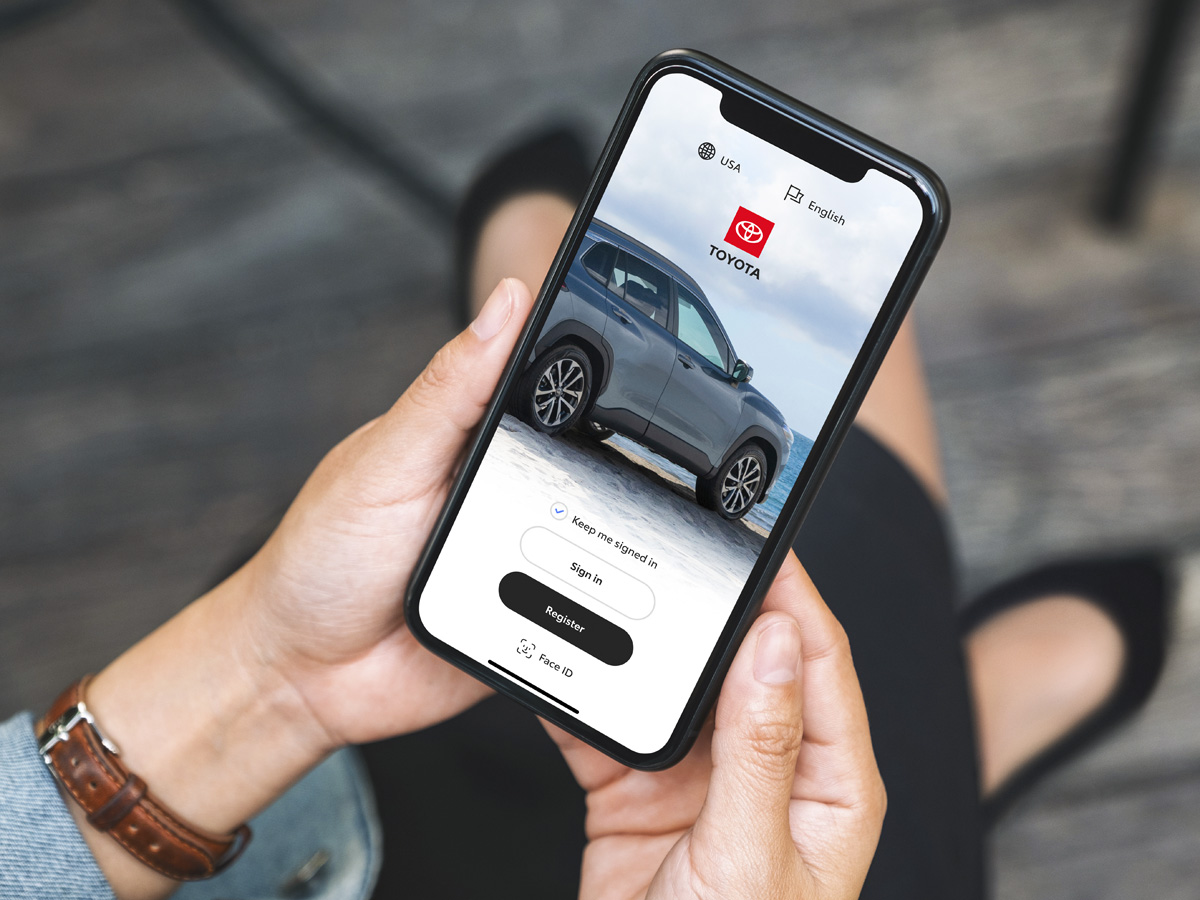 A close-up of a phone with the Toyota app open