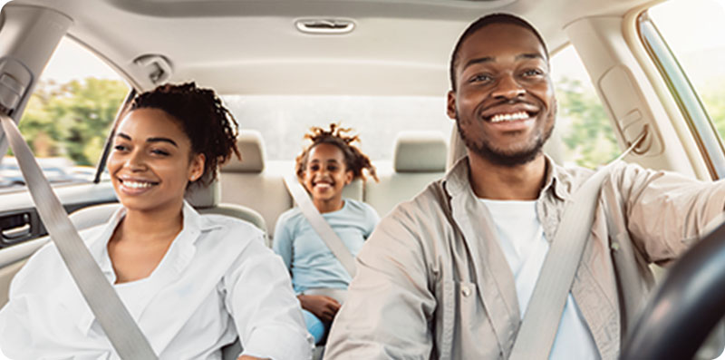 Inside view of a family driving in their car