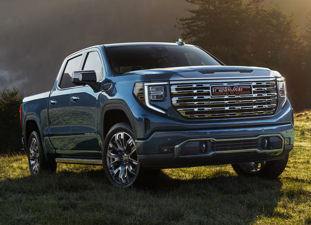 A blue GMC Sierra 1500 Denali luxury pickup truck.