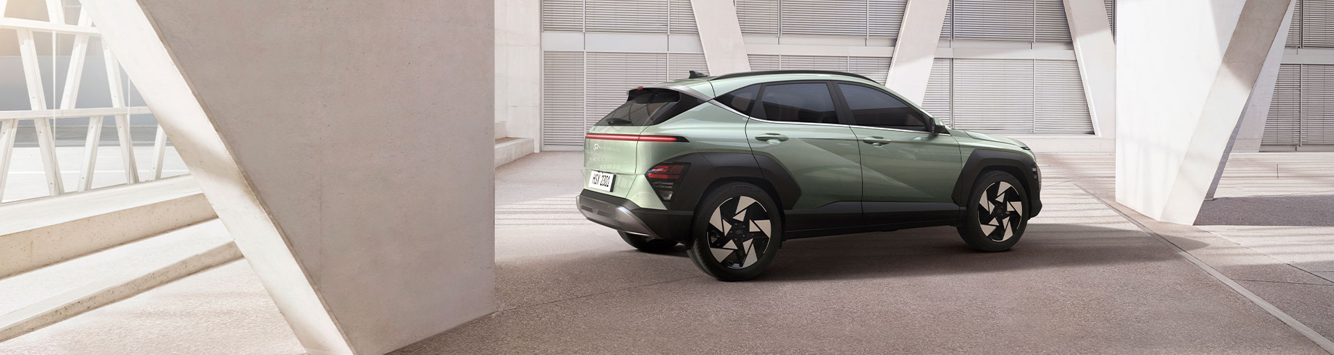 The 2025 Hyundai Kona parked in front of a building