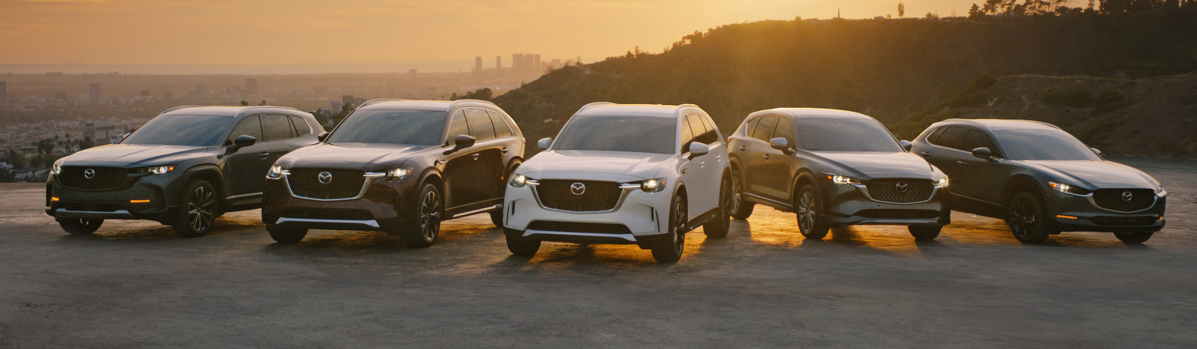A line-up of various Mazda vehicles for sale in Tennessee. All different models, body styles and colors.