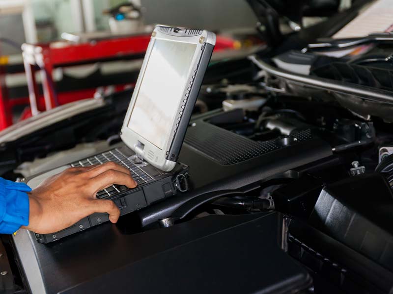Close-up of a technician typing into their diagnostic service program