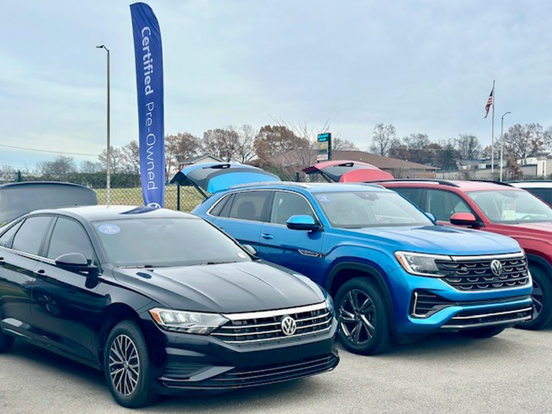 Multiple certified pre-owned Volkswagen models parked on display