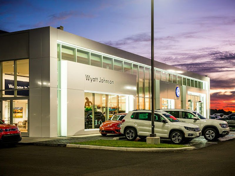 The Wyatt Johnson Volkswagen storefront lit up at night