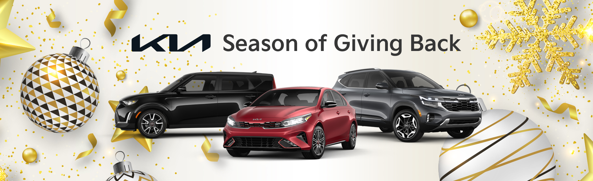 Kia Season of Giving Back Sales Event banner featuring multiple Kia models on display and winter holiday decorations