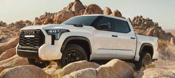 White Toyota truck parked in a desert